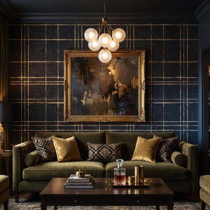 May include: A dark olive green velvet sofa with bolster pillows, featuring gold and black patterned cushions. A dark wood coffee table holds a glass decanter and gold canisters. Above, a gold chandelier hangs before a framed abstract painting.