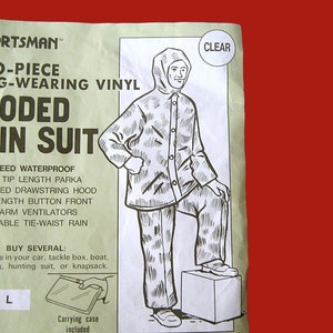 May include: A black and white illustration of a person wearing a hooded vinyl rain suit. The suit has a drawstring hood, button front, and tie-waist. The text on the image reads "O-Piece G-Wearing Vinyl Hooded Rain Suit".