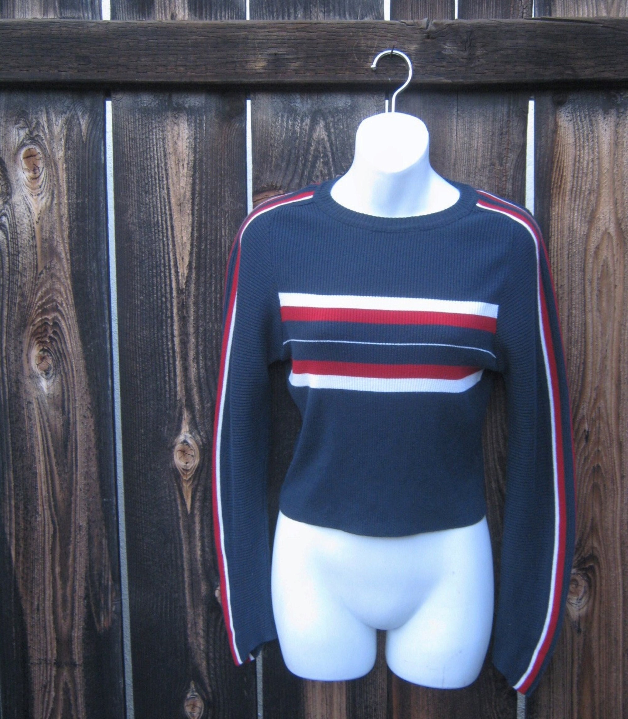 red and navy striped jumper