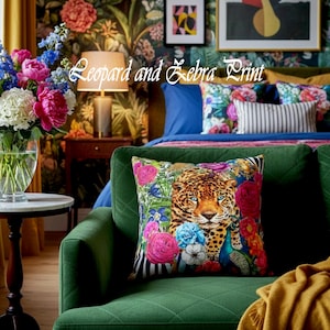 May include: A green velvet sofa with a decorative pillow featuring a leopard face surrounded by colorful flowers. The pillow has a black and white striped border. The background includes a floral wallpaper, artwork, and a vase of flowers.