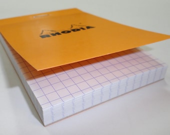 Bloc de notas Rhodia 6x8.25: Papel cuadriculado naranja, apto para pluma estilográfica.