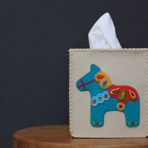 Nikkie&#39;s Felt Dala Horse Tissue Box Cover- A Blue Horse on a Light Beige Background