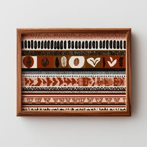 May include: A framed art print featuring a geometric design with earthy tones. The artwork showcases various patterns, including triangles, chevrons, and organic shapes in shades of brown, black, and cream. The wooden frame adds a natural touch.
