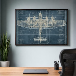 May include: A framed wall art print featuring a technical blueprint of a four-engine airplane. The design displays the aircraft in a top-down view with white line drawings against a dark blue background, including various technical annotations.