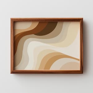 May include: A framed abstract art print featuring a flowing, layered design in shades of brown, beige, and cream. The artwork is encased in a dark brown wooden frame, creating a warm and earthy aesthetic. The print's wavy pattern adds a sense of movement.