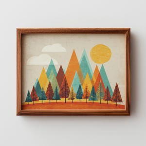 May include: A framed art print showing a geometric landscape. The artwork features colourful triangular mountains in orange, teal, and yellow, with stylised trees below. A yellow sun and white clouds complete the scene.