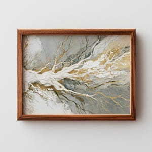 May include: A framed art print featuring an abstract design of a tree with white, gold, and gray branches. The artwork is set against a gray background and framed in a brown wooden frame.