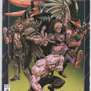 May include: A DC x AEW #2 comic book cover featuring a group of illustrated characters including Batman, a wrestler with feathered shoulder pads, a woman with curly hair, and a masked figure with a mace, all set against a dark background.
