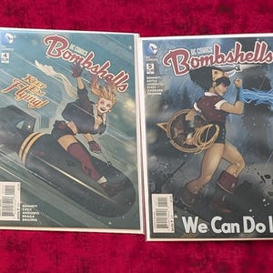 May include: Four DC Comics Bombshells comic books arranged side-by-side. The covers feature illustrated characters in vintage styles with titles including Deliver Us From Evil, Ready to Fly, We Can Do It, and Bombshells United, showcasing vibrant colors.