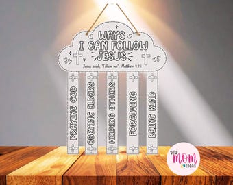 May include: A white cloud-shaped hanging sign with black outlines and text reading WAYS I CAN FOLLOW JESUS, Jesus said, Follow me: Matthew 4:19, and five vertical strips listing PRAYING GOD, OBEYING ELDERS, HELPING OTHERS, FORGIVING, and BEING KIND.