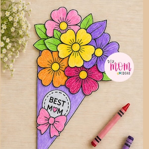 May include: A colorful handmade paper flower bouquet with the words "Best Mom" and a pink bow. The bouquet features pink, orange, yellow, and purple flowers with green leaves. A pink crayon and a purple crayon are also visible.