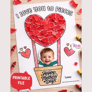 Op de afbeelding: Een afdrukbare Moederdagkaart met de tekst "I love you to Pieces". De kaart toont een rood hart gemaakt van gescheurd papier, een lachende baby in een luchtballonmand en de woorden "Happy Mother's Day."