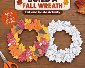 May include: A Build a Fall Wreath cut and paste activity kit featuring a colored wreath and a black and white outline wreath. The design includes leaves, pumpkins, mushrooms, and acorns. Orange scissors are positioned in the lower left corner.
