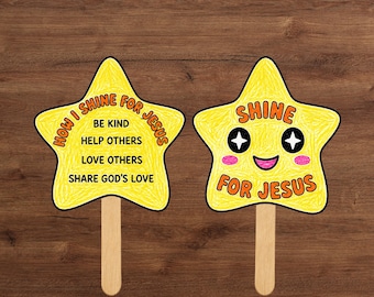 May include: Two yellow star-shaped hand fans with wooden sticks. The left fan features the text "HOW I SHINE FOR JESUS" with "BE KIND, HELP OTHERS, LOVE OTHERS, SHARE GOD'S LOVE". The right fan shows a smiling face with star eyes and "SHINE FOR JESUS".