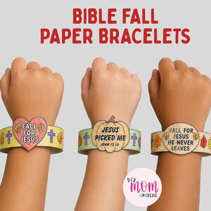 Op de afbeelding: Drie papieren armbanden met herfstthema en religieuze tekst. De eerste toont een hart met 'FALL FOR JESUS', de tweede een pompoen met 'JESUS PICKED ME JOHN 15:16' en de derde een cirkel met 'FALL FOR JESUS HE NEVER LEAVES'.