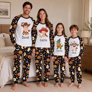 May include: Matching family pajama sets featuring white long-sleeve tops with raglan sleeves and black pants. The tops display Halloween-themed character graphics and names: David, Sophia, Emma, and Jack. The pants have a black background with orange pumpkins, white ghosts, purple witch hats, and yellow moons.