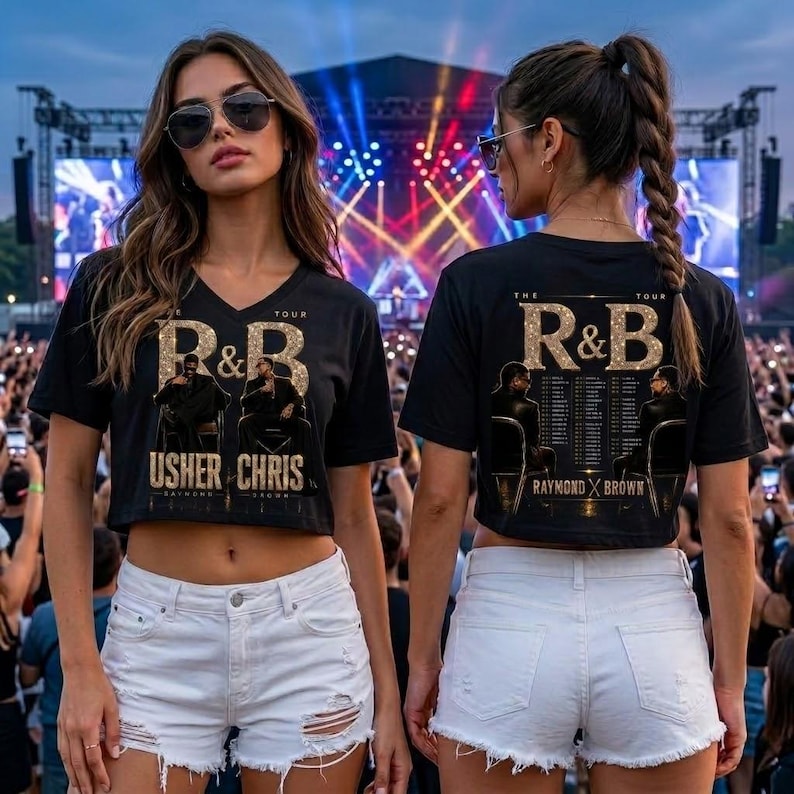 May include: A black cropped t-shirt featuring a gold glitter graphic that reads R&B THE TOUR with images of Usher and Chris Brown. The back of the shirt displays the same graphic with a list of tour dates. The shirt is paired with white denim shorts.