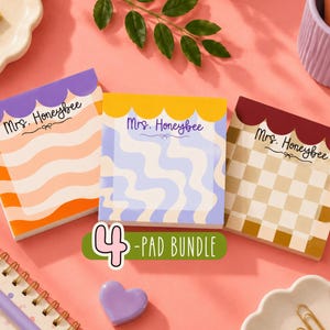 May include: Three square sticky note pads featuring the text Mrs. Honeybee with a bow graphic. The first pad has orange and peach waves with a purple scalloped top. The second has blue and white waves with a yellow scalloped top. The third has a brown and cream checkerboard pattern with a dark red scalloped top.