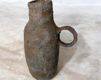 Dark and moody paper clay vase