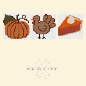 May include: Three cross-stitch patterns featuring a round orange pumpkin with a green leaf, a brown turkey with a red wattle, and a slice of orange pumpkin pie with a dollop of white cream. The text LUCKY GIRL NEEDLEPOINT is centred below.