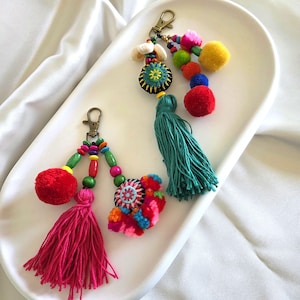 May include: A set of three ceramic mugs with a speckled, matte finish. The mugs are in shades of cream, light gray, and dark gray. Each mug has a simple, minimalist design, perfect for coffee or tea.