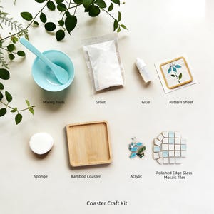May include: A craft kit for making mosaic coasters. The kit includes a light blue mixing bowl and spoon, grout, glue, a pattern sheet, a sponge, a bamboo coaster, acrylic pieces, and polished edge glass mosaic tiles. The text "Coaster Craft Kit" is at the bottom.