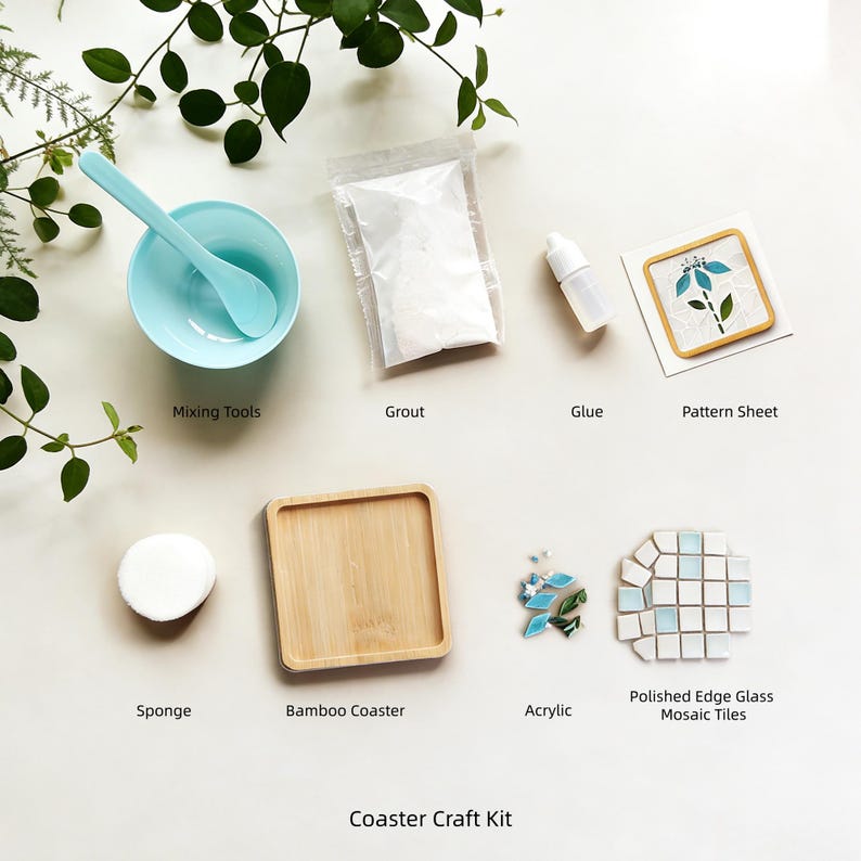 May include: A craft kit for making mosaic coasters. The kit includes a light blue mixing bowl and spoon, grout, glue, a pattern sheet, a sponge, a bamboo coaster, acrylic pieces, and polished edge glass mosaic tiles. The text "Coaster Craft Kit" is at the bottom.