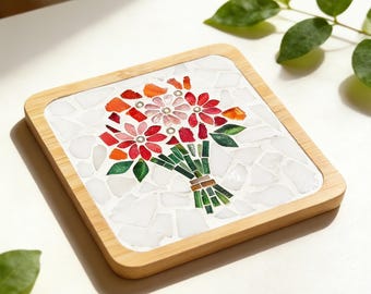 May include: Square mosaic coaster with a bamboo frame. The mosaic features a bouquet of red, pink, and orange flowers with green leaves and stems. The coaster measures 3.54" x 3.54" (9x9cm).