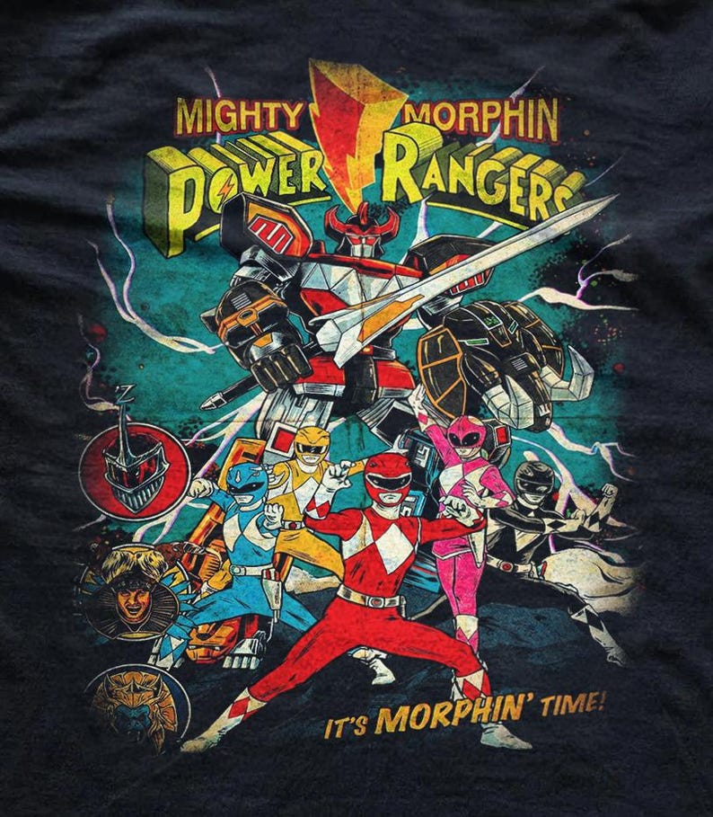 High-detail close-up of a vintage Mighty Morphin Power Rangers graphic print. Features the Megazord and all five Rangers in a distressed, retro comic style with vibrant colors and a weathered texture on soft, dark cotton fabric.
