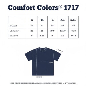 May include: A navy blue t-shirt size chart with measurements in inches. The chart includes width, length, and sleeve measurements for sizes S, M, L, XL, and 2XL. The Comfort Colors 1717 logo is at the top.