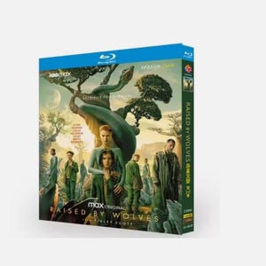 May include: A blue Blu-ray box set for the HBO Max original series "Raised by Wolves." The cover art depicts a surreal landscape with figures and the show's title. The spine shows the show's title and season information.