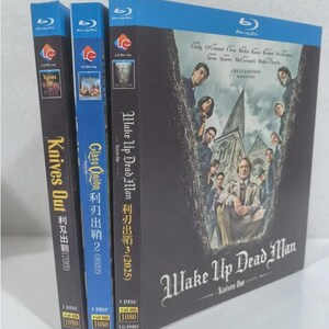 May include: Three Blu-ray movie cases. The cases are for the movies "Knives Out", "Glass Onion", and "Wake Up Dead Man". The cases are black and blue with movie titles and cast information. The "Wake Up Dead Man" case has a dark cover with a group of people in front of a building.