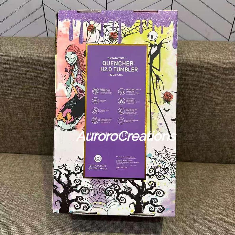 May include: A Stanley Flowstate Quencher H2.0 tumbler box featuring Sally and Jack Skellington from The Nightmare Before Christmas. The box has a purple and yellow background with roses, cobwebs, and trees. The tumbler holds 40 oz (1.18L).