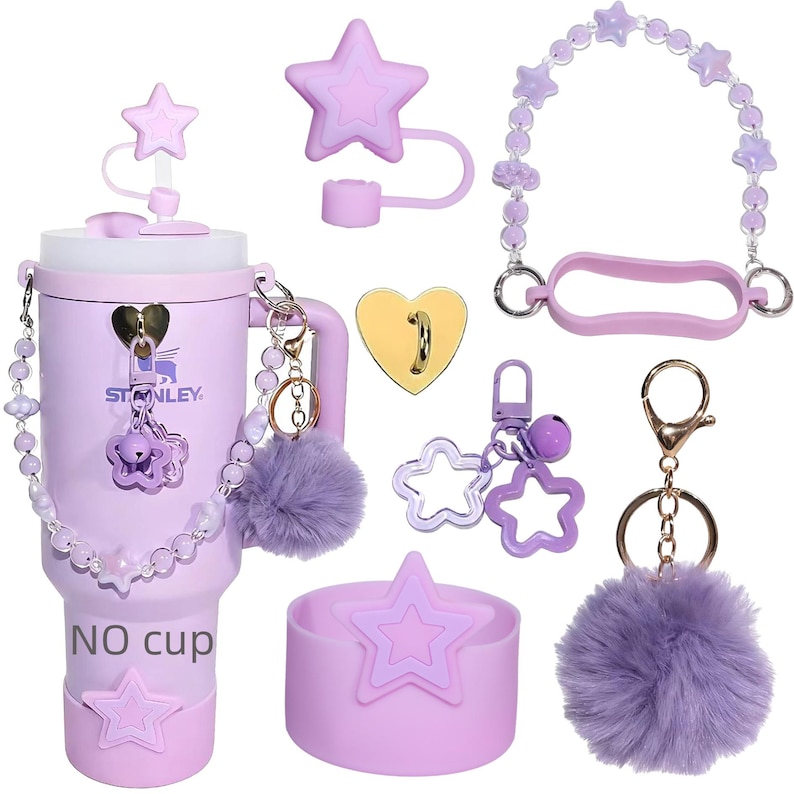 May include: A collection of lavender accessories, including a tumbler, star-shaped lid, beaded handle, keychains, and a pom-pom. The tumbler has the text "NO cup" and a star design. The accessories are designed to fit a Stanley cup.