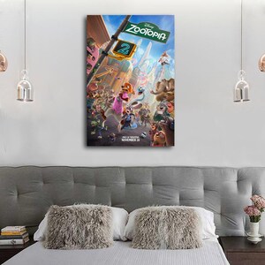May include: A framed Disney Zootopia 2 movie poster. The poster features a vibrant scene with various animal characters in a city setting. The Zootopia logo is at the top, with the release date, November 26, at the bottom.