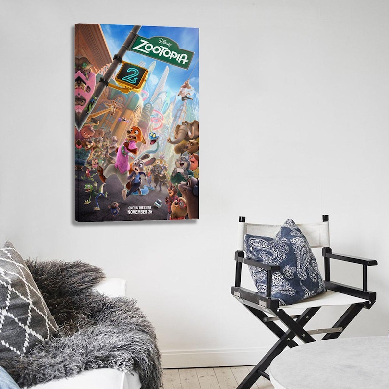 May include: A framed canvas print of the Disney movie "Zootopia 2" poster. The poster features a vibrant scene with numerous animated animal characters in a city setting. The sign reads "Zootopia" and "2". The release date is November 26.