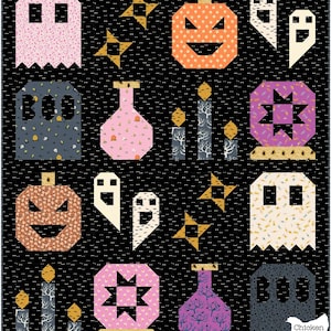 May include: A Halloween-themed quilt featuring various geometric shapes. The design includes pumpkins, ghosts, stars, candles, and potion bottles in shades of orange, pink, purple, and gray against a black background. The word "BOO" is also visible.