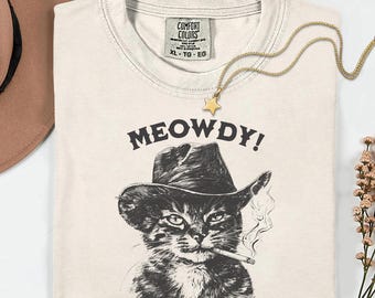 Gato vaquero maullador PNG, diseño divertido de gatito del oeste, gráfico de gato retro de los 90, arte de gato campestre vintage, linda gatita vaquera PNG