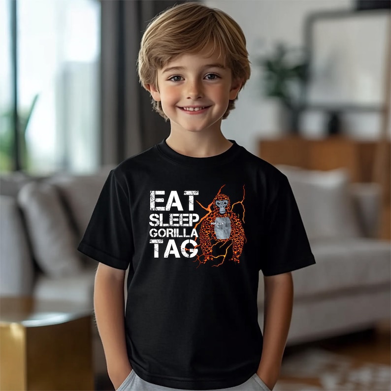 a young boy standing in front of a couch