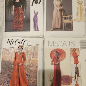 May include: Four McCall's sewing patterns featuring different dress designs. The patterns include a long, red dress with a high collar, a long, pink dress with a high waist, a long, purple dress with a fitted bodice, and a long, yellow dress with a simple design.