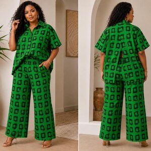 May include: A two-piece set consisting of a short-sleeved button-down shirt and wide-leg trousers, both featuring a vibrant green base with a repeating black square pattern. The shirt has a collar and a split back design, while the pants have a waistband.