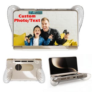 May include: A clear, ergonomic handheld gaming console case with textured side grips. The top view displays a custom photo of a child and adult playing video games with the red text Custom Photo/Text. The bottom views show the case structure.
