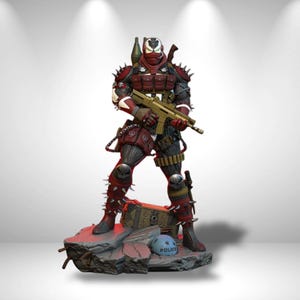 May include: A detailed action figure of a masked character in red and black tactical gear with spikes, holding a tan rifle. The figure stands on a rocky base with a small blue helmet labeled POLICE and a wooden crate, featuring intricate armor details.