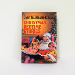 May include: A book cover featuring a red and white illustration of Santa Claus reading a book to two children by a fireplace. The book title is "Christmas Bedtime Stories" and is part of the "Great Illustrated Classics" series.