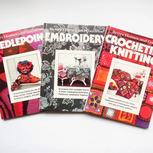 May include: Three Better Homes and Gardens craft books with colorful covers. The books are titled "Needlepoint", "Embroidery", and "Crocheting & Knitting".