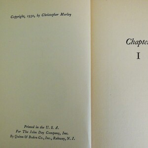 May include: A book with the title "Chapter I" on the right page and copyright information on the left page. The copyright information includes the year 1930 and the author Christopher Morley.