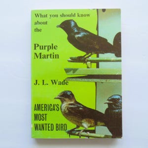 May include: A vintage book cover with a bright green background. The title "What you should know about the Purple Martin" is displayed in white text. The cover features illustrations of purple martins and the text "America's Most Wanted Bird."