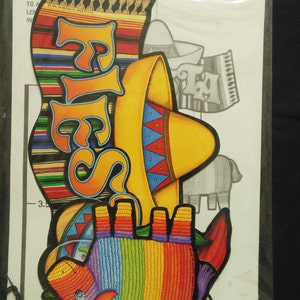 May include: A set of colorful paper cutouts for a fiesta party. The set includes a sombrero, a donkey, a banner that says "Fiesta", and a banner that says "Ta!" The cutouts are on a white background.