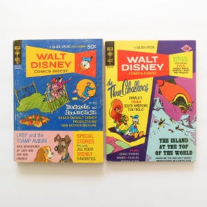 May include: Two vintage Walt Disney Comics Digests. The first features "Bedknobs and Broomsticks" and "Lady and the Tramp." The second features "The Three Caballeros" and "The Island at the Top of the World." Both have colorful illustrations and text.