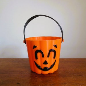 Halloween Pumpkin Container, Small Spearhead Jack O Lantern Bucket, Orange Ribbed With Black Handle and Happy Face
